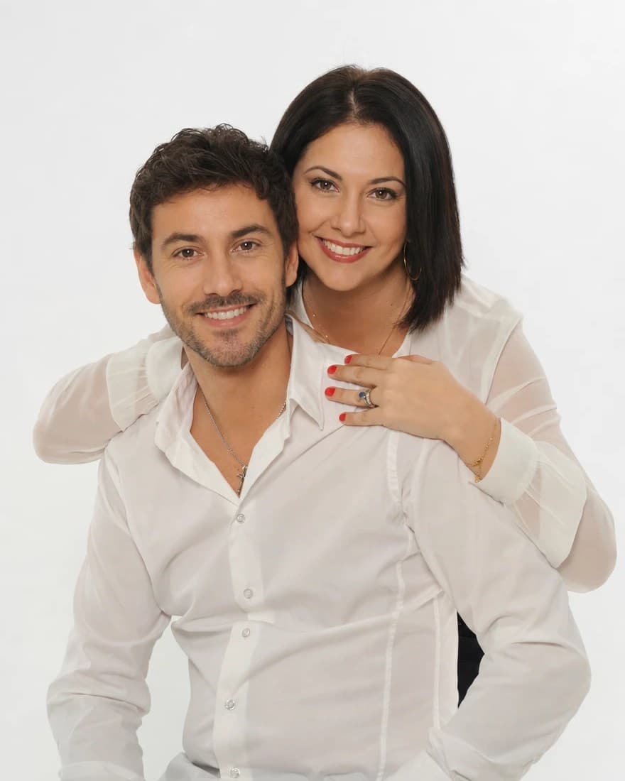 A couple in white shirts, on a white backdrop